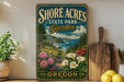 A vintage-style sign for Shore Acres State Park Garden in Oregon, featuring a scenic landscape with a garden, ocean, and mountains.