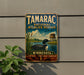 A vintage-style metal sign for Tamarac National Wildlife Refuge in Minnesota, featuring an illustration of a bird in a lake surrounded by reeds and a birdhouse.