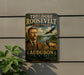 a vintage-style sign for Theodore Roosevelt's sanctuary, with a portrait of the former US President and an illustration of a deer and an eagle.