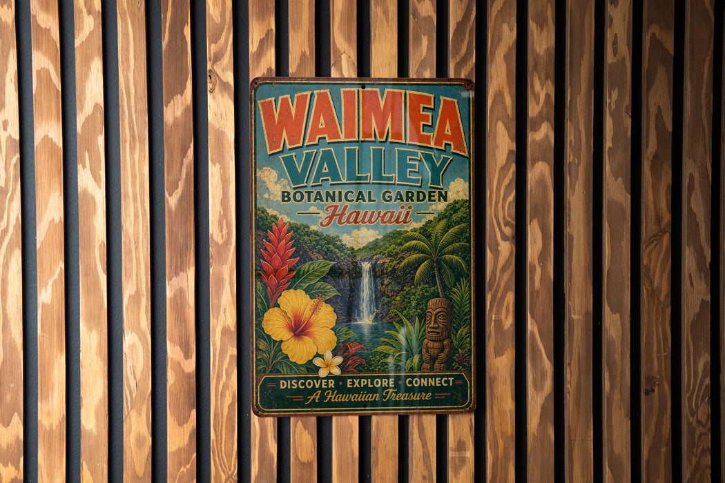 A vintage-style metal sign for Waimea Valley Botanical Garden in Hawaii, featuring a tropical landscape with a waterfall and various flora.