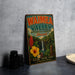A vintage-style metal sign for Waimea Valley Botanical Garden in Hawaii, featuring colorful illustrations of tropical plants and a waterfall.