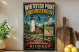 A vintage-style metal sign for the Whitefish Point Bird Observatory in Michigan, featuring a lighthouse, birds, and a sign for bird research and conservation.