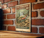 A vintage-style postage stamp featuring a chum salmon, which is a type of fish, is displayed on a brick wall.