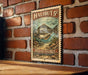 A metal sign with a fish illustration and text, mounted on a brick wall.