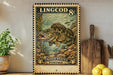 A vintage postage stamp featuring a large fish, likely a carp, is displayed on a wall next to a wooden cutting board and some kitchen utensils.