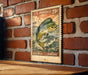 A vintage U.S. postage stamp featuring a large fish, likely a Mahi Mahi, is displayed on a brick wall.