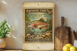 a vintage-style stamp depicting a rainbow trout, with a price of 5 cents, placed on a wooden surface next to a potted plant and a wooden cutting board.