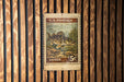 A U.S. postage stamp featuring a fish, mounted on a wooden wall.