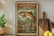 A framed print of a fish, likely a steelhead, is displayed on a wall next to a wooden cutting board and some lemons.