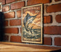 A framed image of a striped marlin fish, with a 20-cent stamp on the border, is displayed on a brick wall.