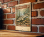 A vintage postage stamp featuring a sturgeon fish, which is a type of fish, is displayed on a wooden surface against a brick wall.