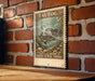 A vintage 5¢ Tautog postage stamp from the United States, featuring a blackfish illustration, is displayed on a brick wall.