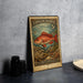 A vintage postage stamp featuring a red fish, likely a Vermilion Snapper, on a coral reef.