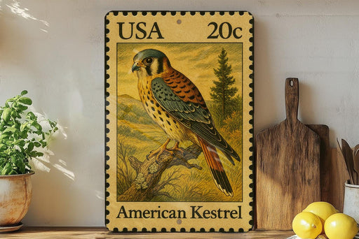 A framed American Kestrel postage stamp is displayed on a shelf, with a potted plant, wooden cutting board, and lemons nearby.
