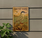 a sign with an illustration of a bird, specifically an Arctic tern, perched on a rock.