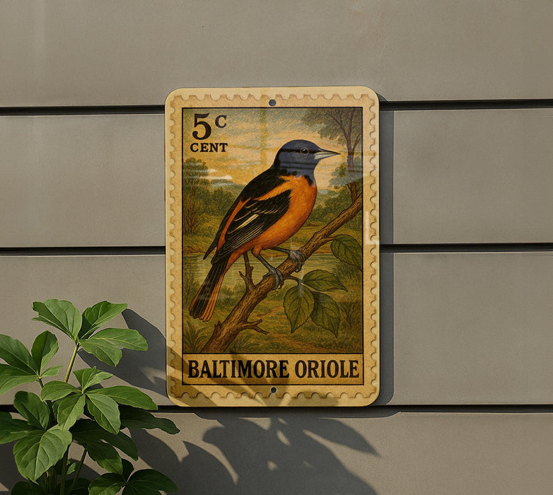 A Baltimore Oriole postage stamp is displayed on a wall, featuring a detailed illustration of the bird perched on a branch.