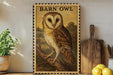 a framed illustration of a barn owl, a type of bird of prey, perched on a branch. The owl is depicted in a detailed and realistic manner, with its distinctive features such as its large eyes, pointed beak, and brown plumage clearly visible. The framed artwork is displayed on a shelf, surrounded by various kitchen utensils and decorative items, creating a cozy and homey atmosphere.