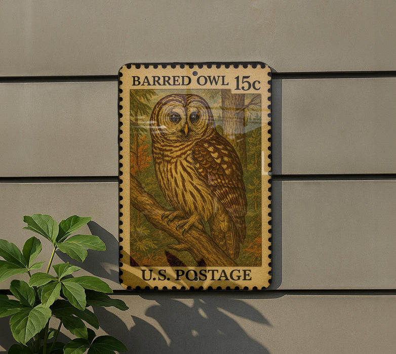 A postage stamp featuring an illustration of a barred owl, with the text "BARRED Owl 15c" and "U.S. POSTAGE" printed on it.