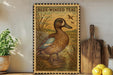 A framed illustration of a blue-winged teal duck is displayed on a shelf, surrounded by kitchen utensils and a potted plant.