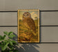 a framed illustration of an owl perched on a rock, set against a natural landscape.