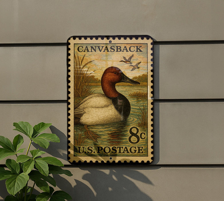 A postage stamp featuring a duck on a wall, with the text "Canvasback 8c U.S. Postage".