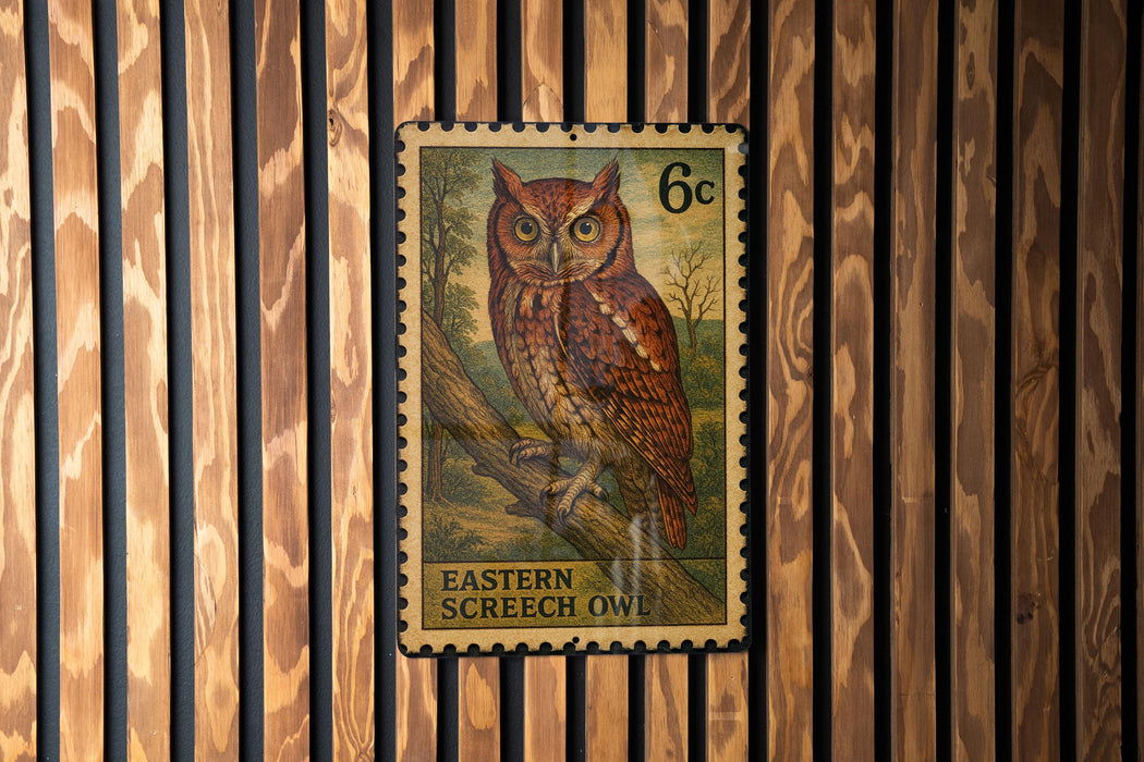 A postage stamp featuring an illustration of an Eastern Screech Owl, which is a type of owl native to the eastern United States and Canada.