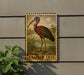 a wooden stamp-like sign with a picture of a bird, specifically a Glossy Ibis, standing on a grassy area.