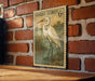 A vintage postage stamp featuring a white heron is displayed on a brick wall.