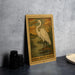 a framed illustration of a great white heron standing on a lake, with the text "GREAT WHITE HERON" below the illustration.