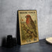 A vintage-style postage stamp featuring a red-headed bird perched on a branch, with the text "HOUSE FINCH" and "U.S. 8c" printed on it.
