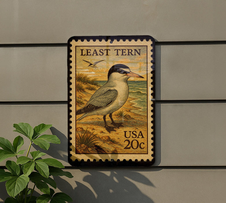 A postage stamp featuring a bird, likely a least tern, on a wall.