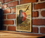 a vintage postage stamp with a black and red bird, likely a frigatebird, depicted on a brick wall.