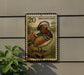 A postage stamp featuring a colorful illustration of a mandarin duck, mounted on a wall next to a plant.