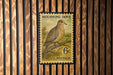A U.S. postage stamp featuring a mourning dove perched on a branch.