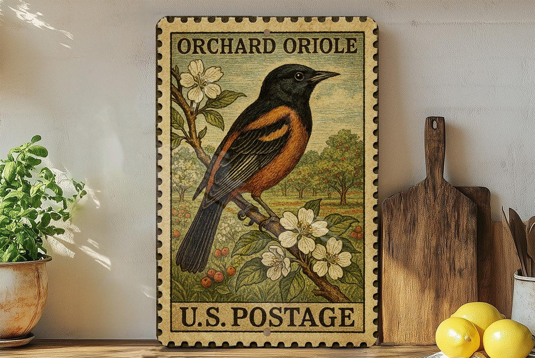 A vintage U.S. postage stamp featuring an orange oriole perched on a branch with white flowers, displayed on a shelf next to a wooden cutting board and a potted plant.