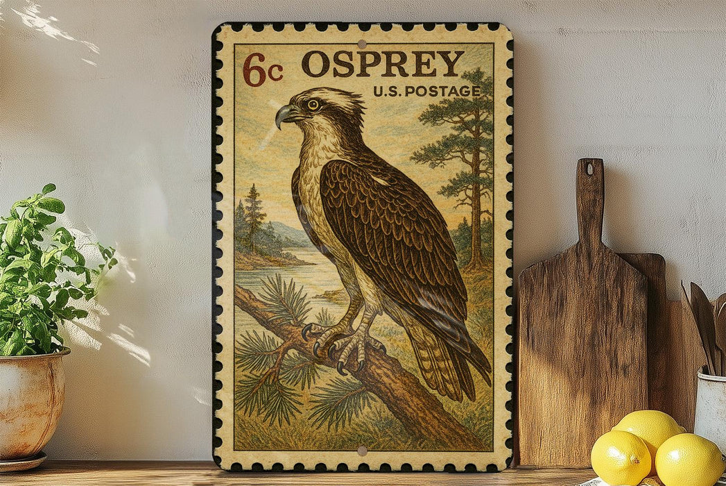 a framed stamp depicting an Osprey, a large bird of prey, perched on a branch. The stamp is placed on a shelf next to a wooden cutting board and a potted plant.