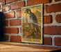 A framed illustration of a peregrine falcon is displayed on a brick wall, with the word "Peregrine Falcon" written below the image.