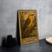 A metal stamp featuring a yellow warbler perched on a branch, with the text "PRONONOTARY WARBLER" printed on it.
