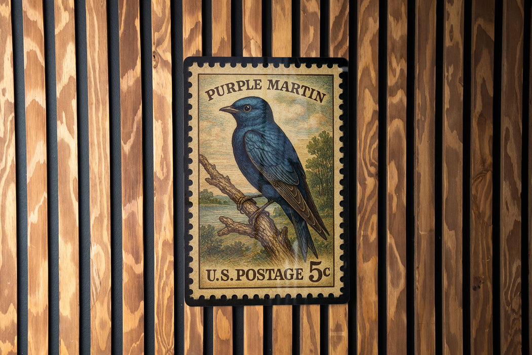 A vintage U.S. postage stamp featuring a blue bird perched on a branch, mounted on a wooden wall.
