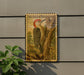 A vintage U.S. postage stamp featuring a red-bellied woodpecker perched on a tree trunk, mounted on a wall.