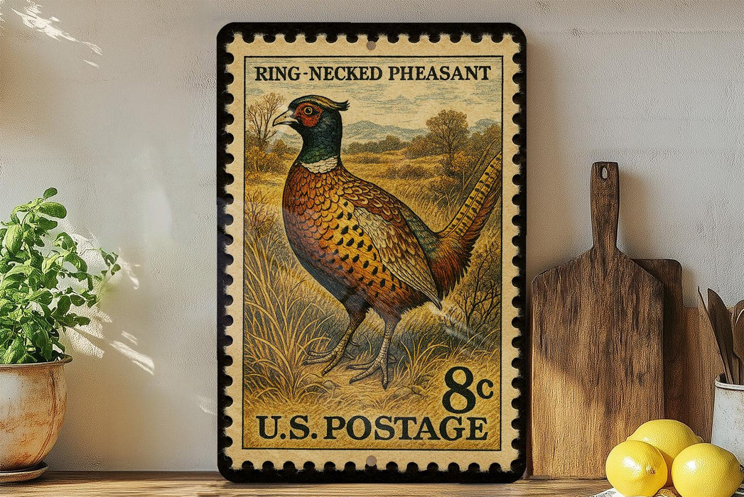 A framed postage stamp featuring a pheasant, with a pheasant standing in a field and the text "RING-NEECKED PHEASANT" and "U.S. POSTAGE".