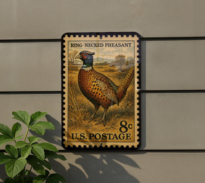 A vintage U.S. postage stamp featuring a pheasant standing in a grassy field.