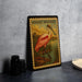 A framed illustration of a pink spoonbill bird, with the text "ROSEATE SPONONBILL" on the top and bottom corners, is displayed on a gray wall.