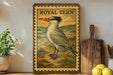 A framed illustration of a bird, likely a seagull, is displayed on a shelf next to a wooden cutting board and some kitchen utensils.