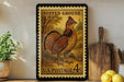 A framed postage stamp featuring a detailed illustration of a grouse, with the text "RUFFED GROUSE" and "U.S. POSTAGE 4c" printed on it. The stamp is displayed on a shelf next to a wooden cutting board and a potted plant.