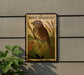 A framed illustration of a bird, specifically a sparrow, is displayed on a wall.