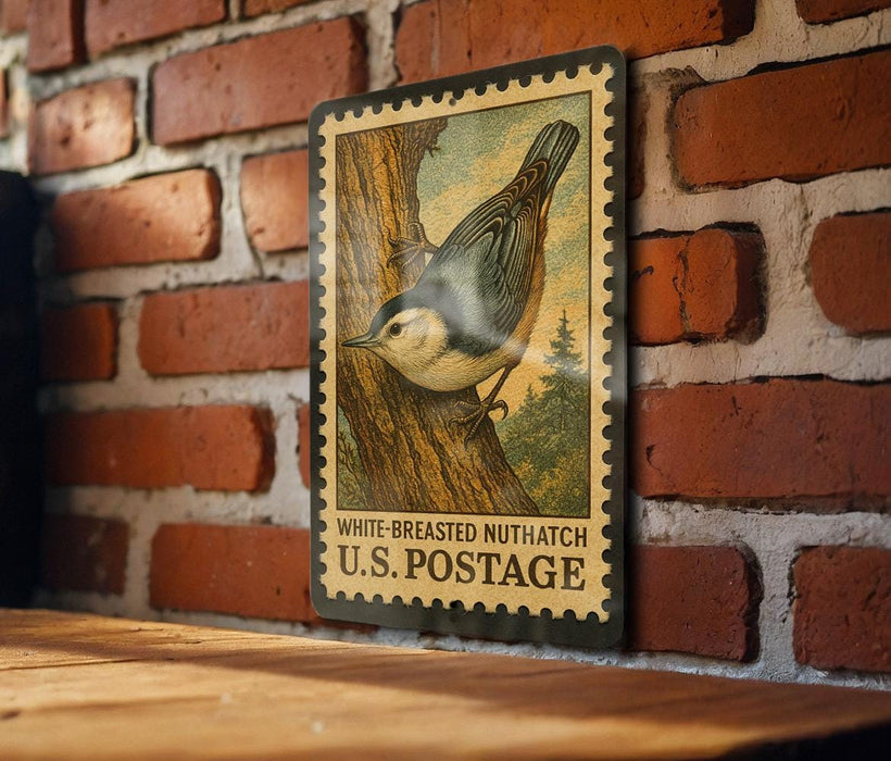 A vintage postage stamp featuring a white-breasted nuthatch is displayed on a brick wall.