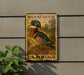 A vintage-style postage stamp featuring a wood duck, mounted on a wall next to a plant.