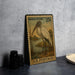 A vintage 25c U.S. postage stamp featuring a wood stork standing on a riverbank, with a blurred background.