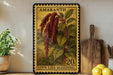 a vintage-style stamp with a plant illustration, placed on a shelf next to a wooden cutting board and some potted plants.